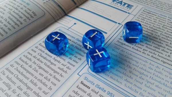 Fate dice and rulebook